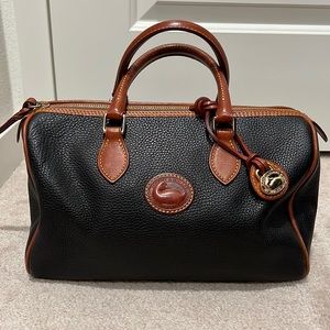Dooney & Bourke - Black pebbled with brown leather handles and zippers